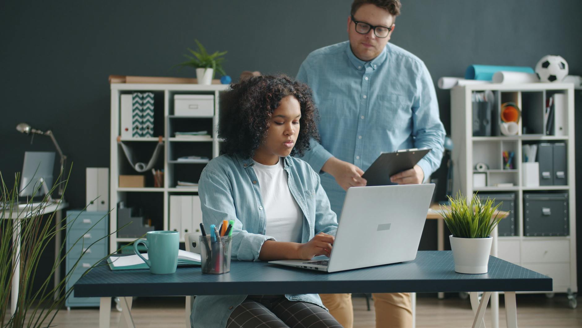 two professionals working in a modern office