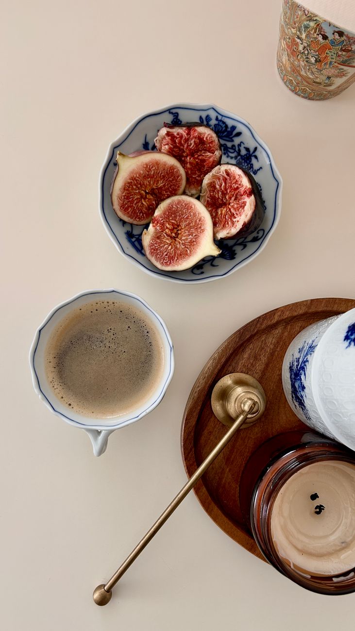 elegant breakfast setting with figs and coffee